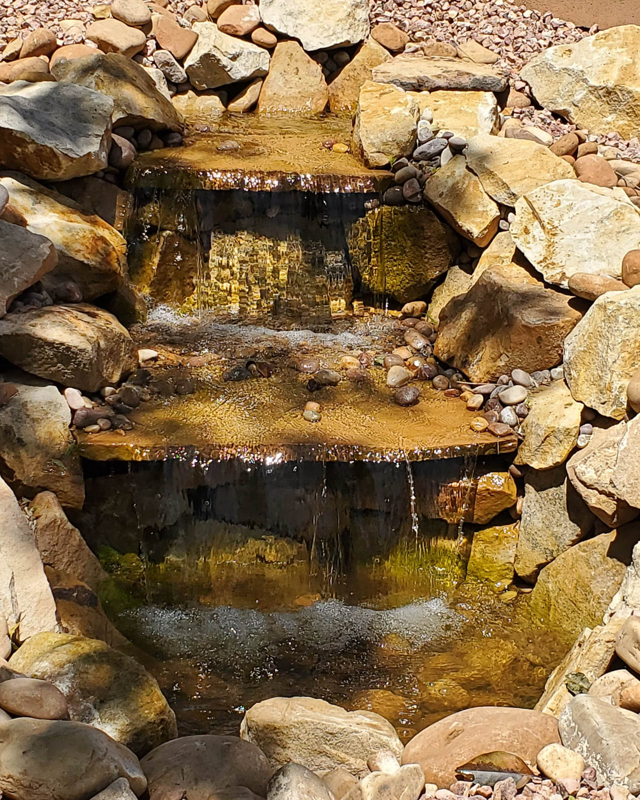 Natural stone cascading waterfall